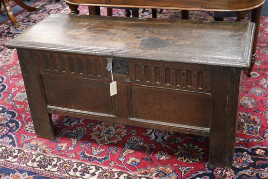 A 17th century oak coffer W.112cm